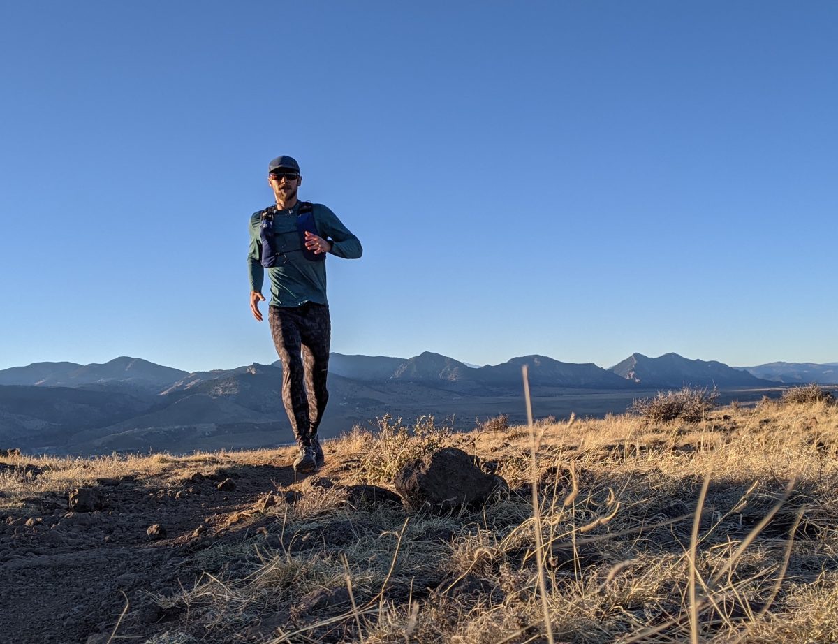 The Slope Runner vest fits like an extra shirt and holds everything you need for long trail runs. The front pockets fit two 500-mL flasks along with phone, gloves, and goo packets, and you can shove your pants and windbreaker in the pocket across the back